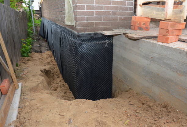 Happy homeowners after waterproofing job in Highland Park